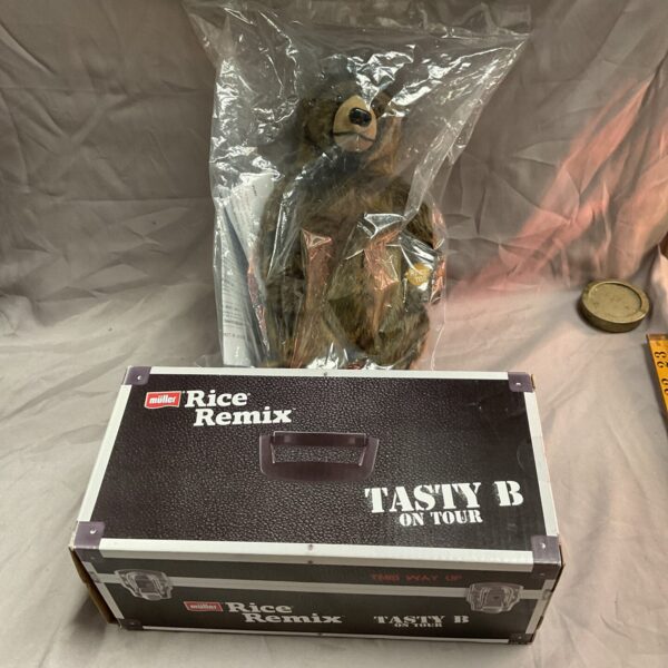 Sealed vintage Muller Rice Remix Bear in plastic packaging.