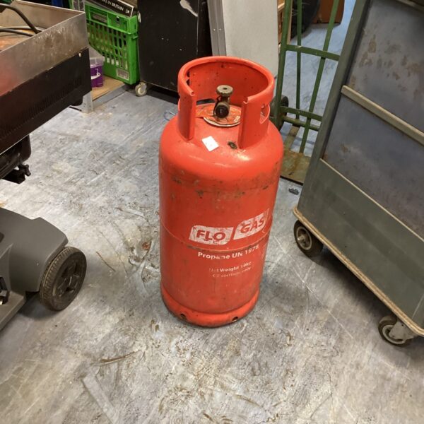 Red Flo Gas propane bottle for outdoor use.