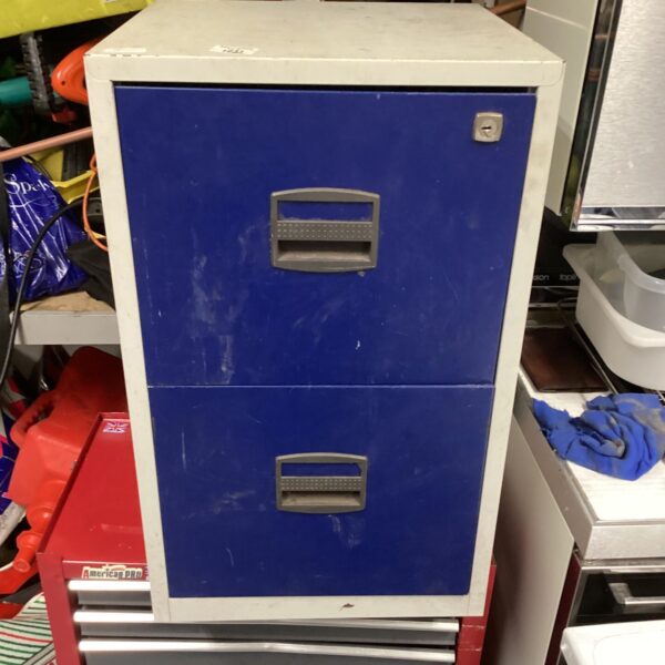 Vintage blue metal filing cabinet for office storage.
