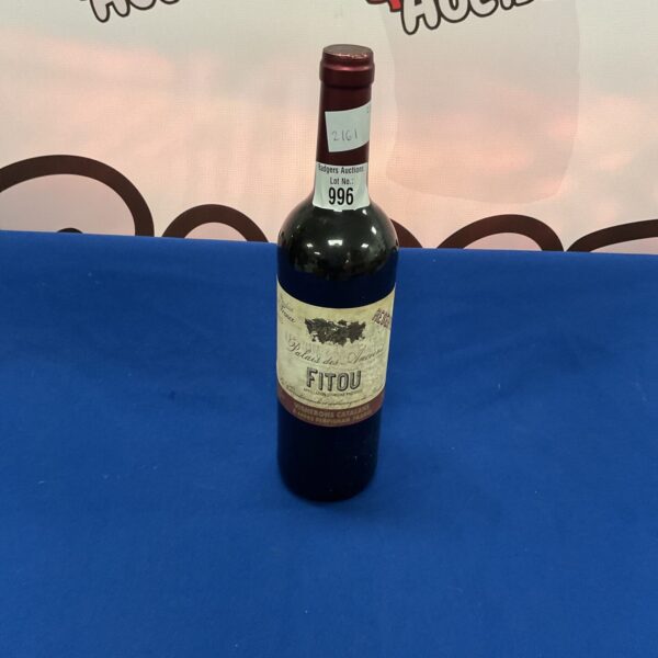 Vintage 2013 bottle of French Fitou red wine with "palais des anciend" label.