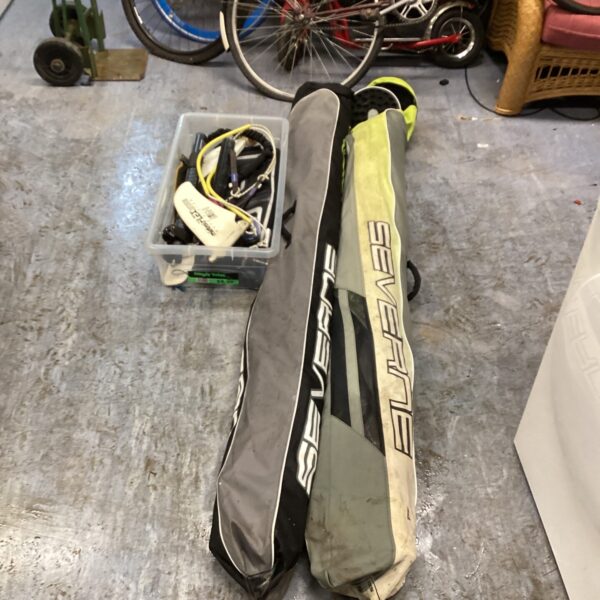 Vintage sailboard sails for windsurfing and watersports equipment.