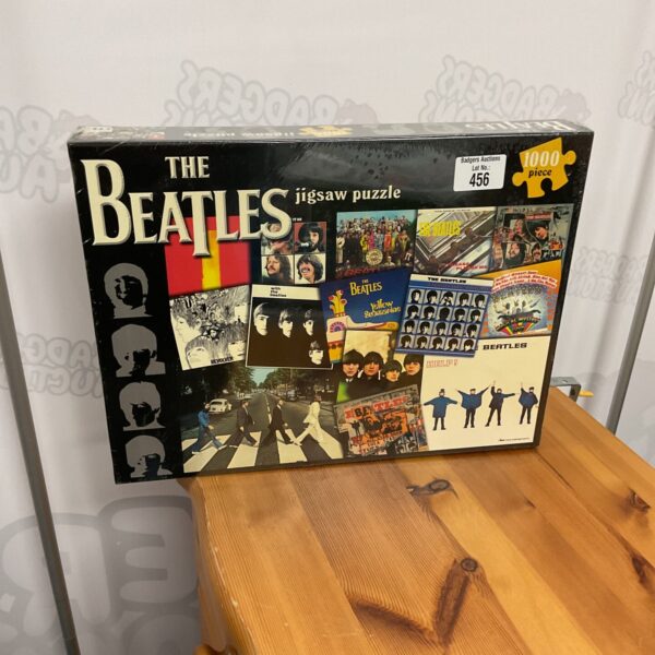Sealed Beatles jigsaw puzzle, 1000 pieces, collectible music memorabilia.