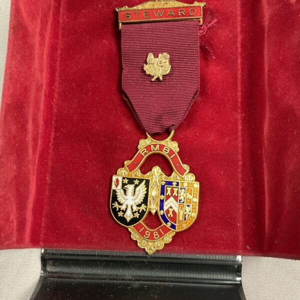 Antique Masonic Stewards Jewel with RMBI ribbon, detailed craftsmanship.