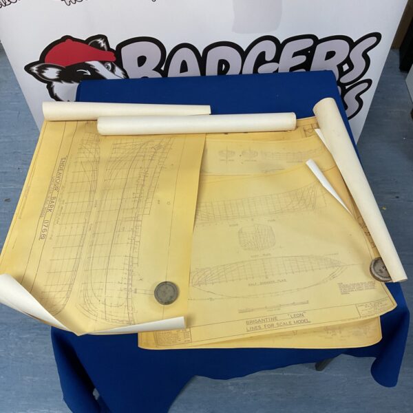Vintage roll of scale model schematics for nautical designs and canons.