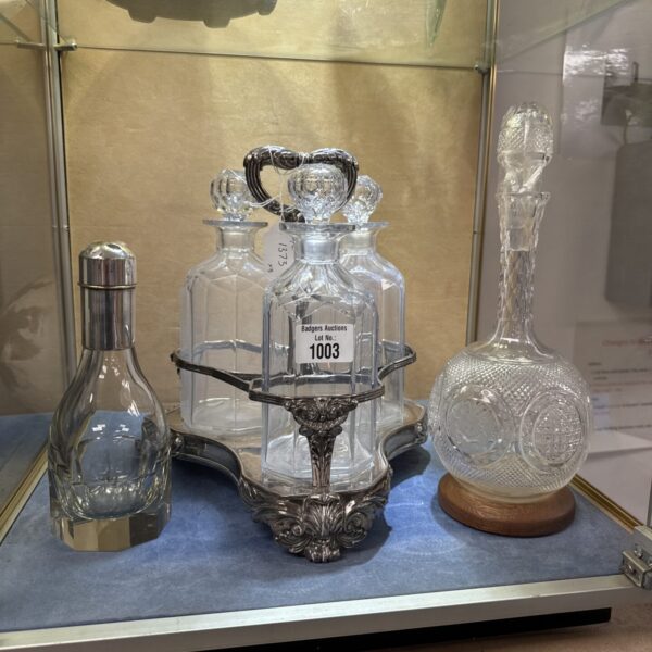 Silver plate three decanter tantalus with two crystal decanters
