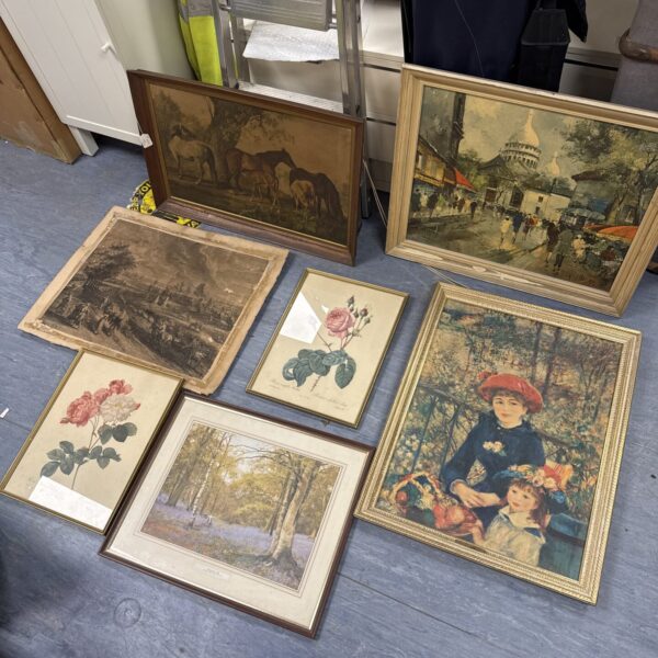 Assortment of seven framed vintage prints for wall decor.