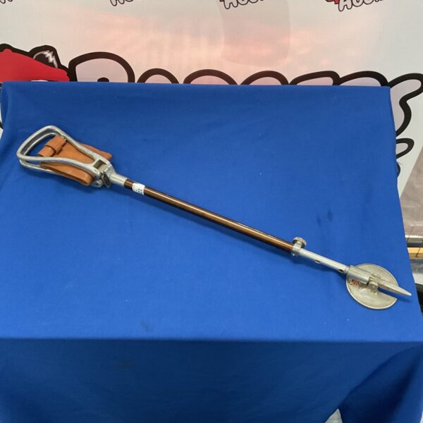 Vintage game shooting stick with wooden shaft and adjustable legs.
