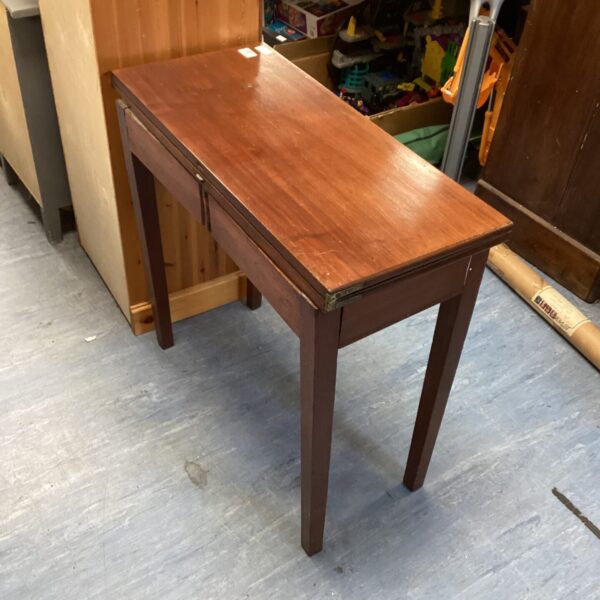 Vintage mahogany folding side table with a warm wood tone.