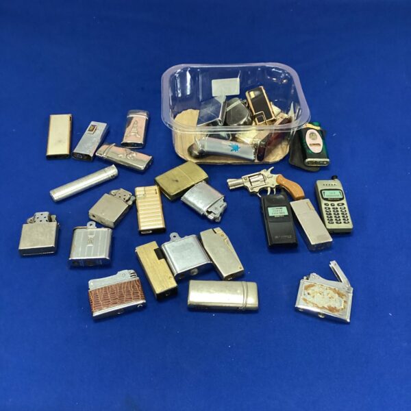 Assorted vintage and novelty lighters in a plastic tub.