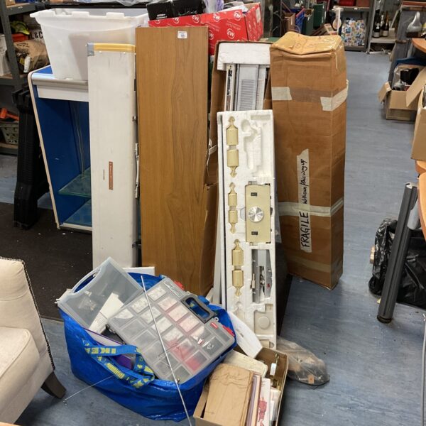 Large sewing and crafting lot with knitting machine and patterns.