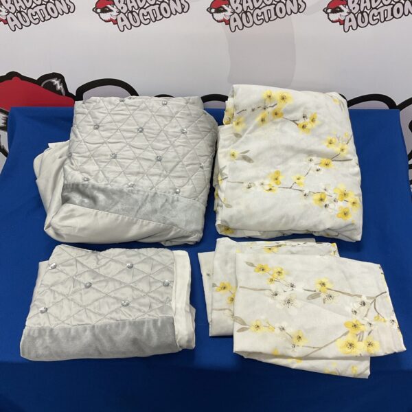 Floral duvet cover set with matching pillowcases, light background.