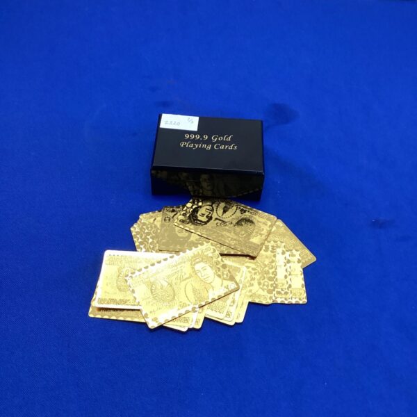 Gold playing cards deck with box, unique collectible card set.
