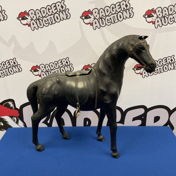 Vintage black leather horse sculpture, detailed equestrian art.