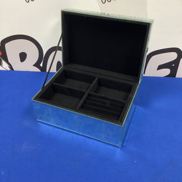 Vintage mirrored jewellery box with open lid, showing compartments.