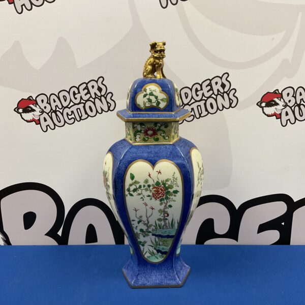 Vibrant mid-century ceramic jar with floral pattern.