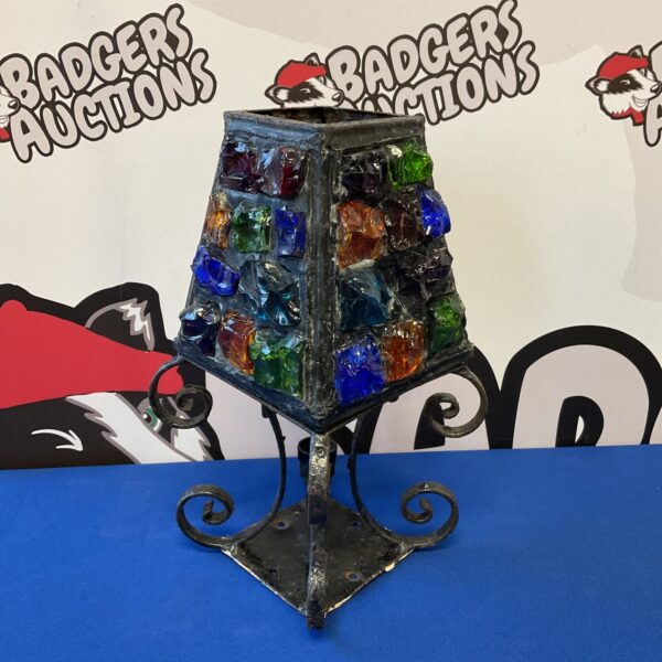 Vintage coloured glass candle lamp with wrought iron frame.