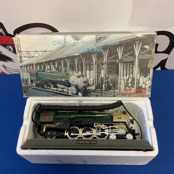 Vintage Telemania Crescent Train 1925 novelty telephone, side view.