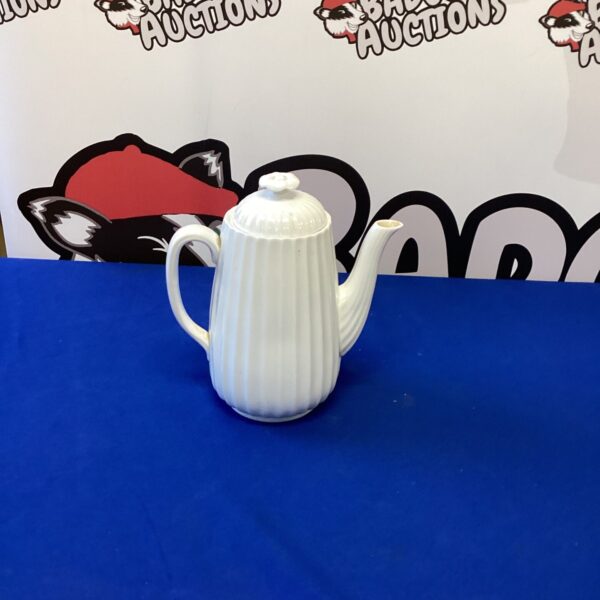 Vintage white porcelain coffee pot for collectors and display.