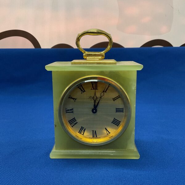 Antique green marble carriage clock with Roman numerals.