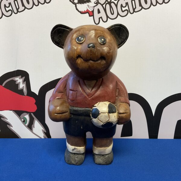 Vintage wooden teddy bear footballer, carved folk art figure.
