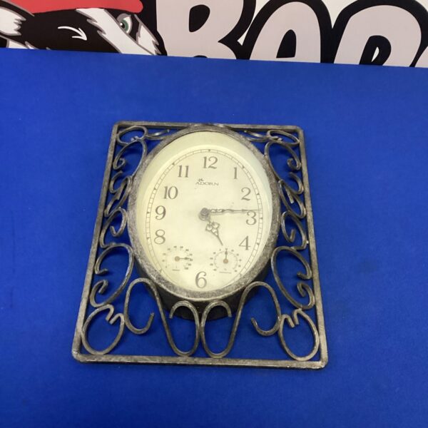 Vintage Adorn wall clock with metal frame and bold numerals.