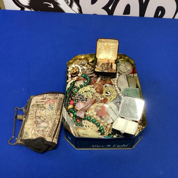 Vintage costume jewellery lot in decorative tin, mixed fashion accessories.