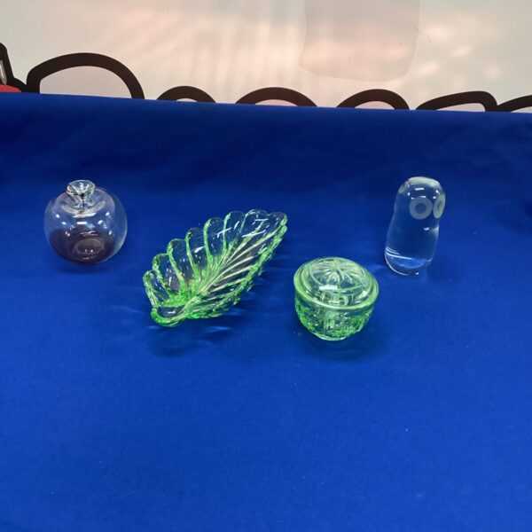 Vintage glass collection featuring a penguin and scallop dish.