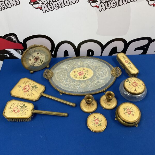 Vintage embroidered dressing table set with floral details.