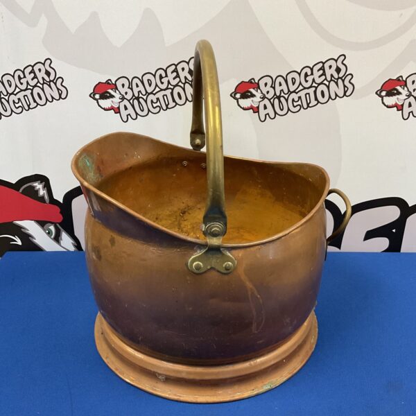 Vintage copper helmet coal scuttle for fireplace use.