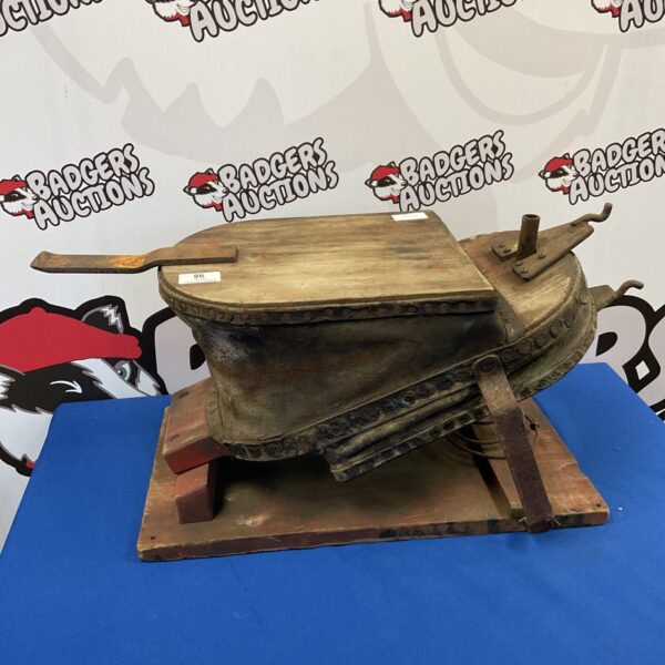 Antique blacksmith bellows with wooden frame and leather section.
