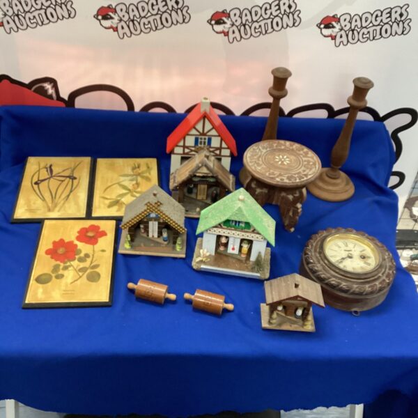 Vintage weathervanes and collectible metal figures on display.