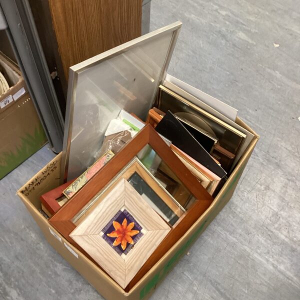 Large lot of assorted vintage and wooden picture frames for sale.