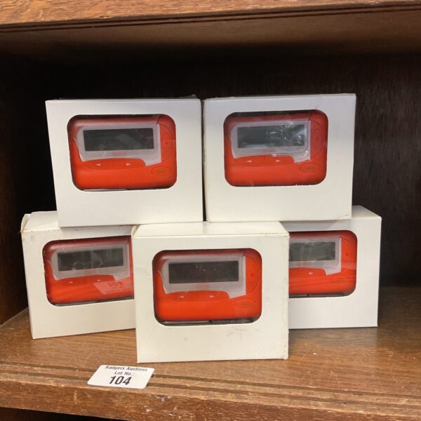 Lot of five vintage orange numeric pagers, model ez-2028.