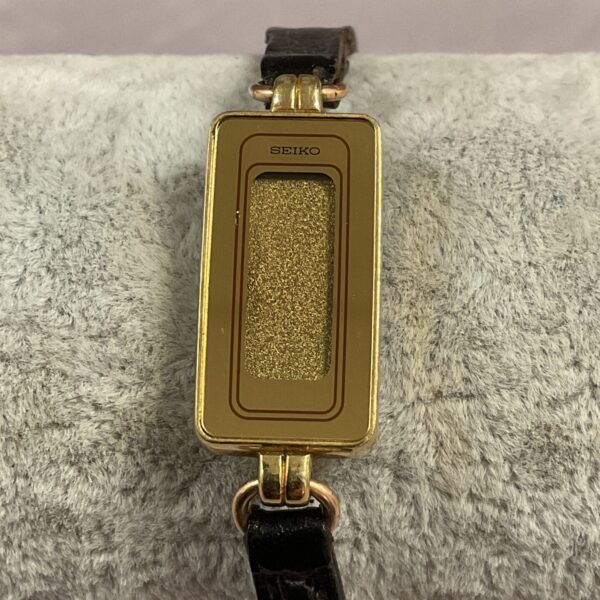 Close-up of vintage Seiko digital ladies watch with gold tone case.