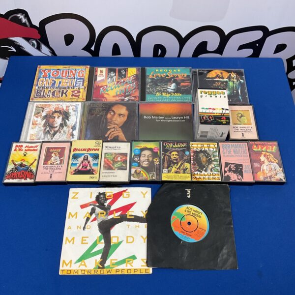 Vintage Bob Marley reggae collection including cassettes, CDs and vinyl records.