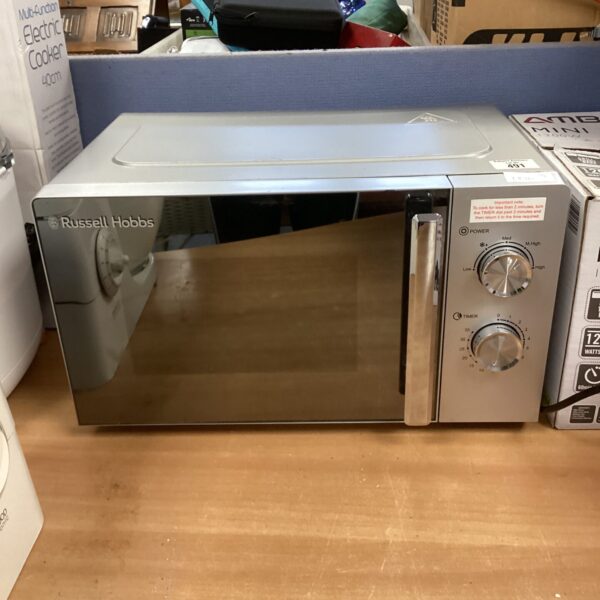 Stainless steel Russell Hobbs microwave oven on a countertop.