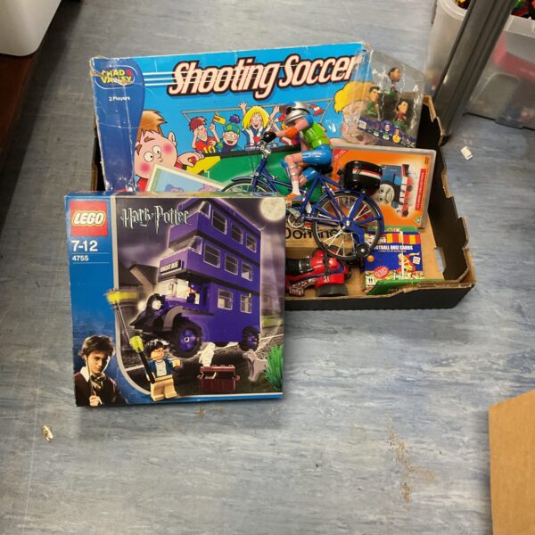 Mixed toy lot featuring Lego Harry Potter and shooting soccer game.