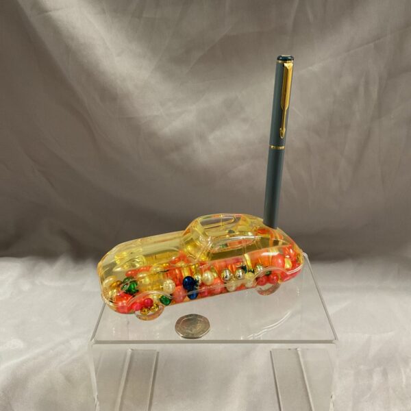 Vintage lucite Porsche paperweight with colourful spheres.