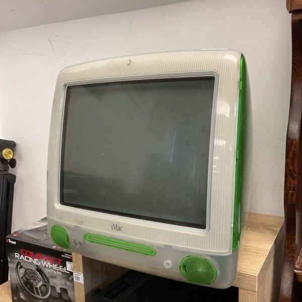 Vintage Bondi Blue iMac G3 computer, a classic Apple design.