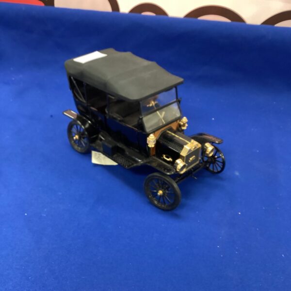 Black Franklin Mint Ford Model T diecast collectible car.
