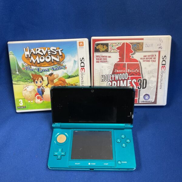 Nintendo 3DS console with game cartridges, portable gaming system.