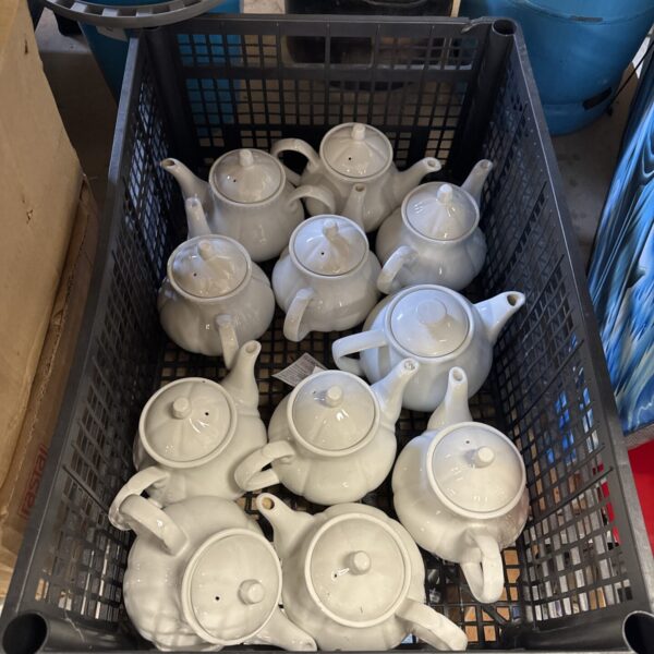 Tray of white porcelain catering tea pots for restaurants.