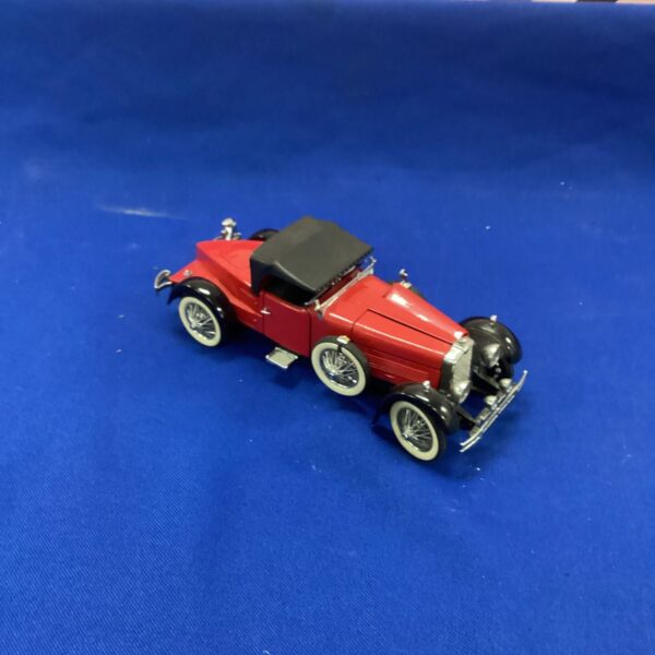 Red Franklin Mint Boxtail Speedster diecast model car on display.