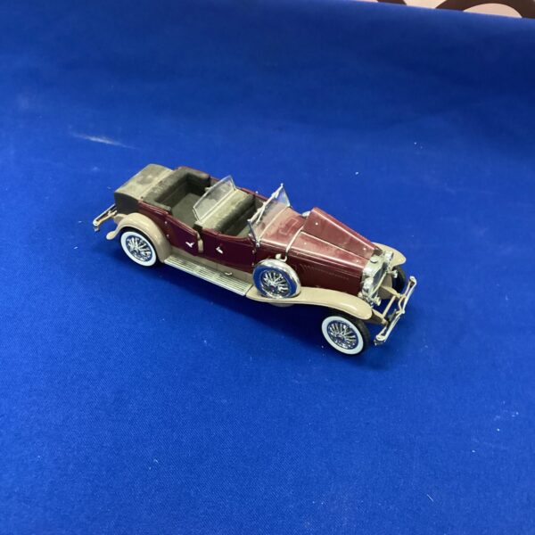 Burgundy Franklin Mint Duesenberg model car, classic collectible.