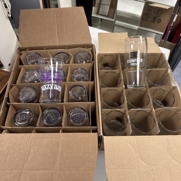 Collection of Greene King & Stowford Press branded pint glasses.