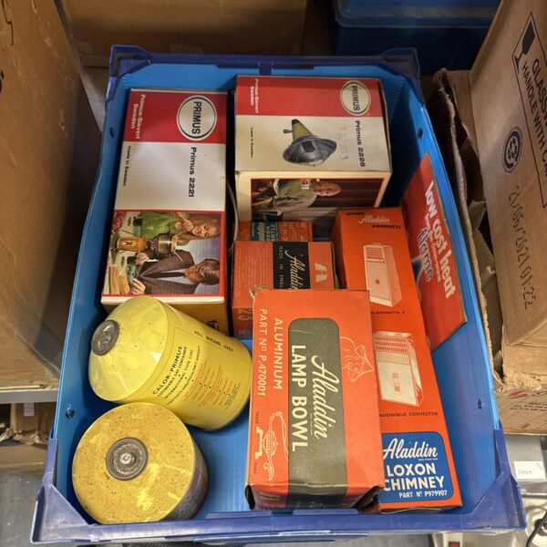 Vintage camping equipment lot featuring Primus stove and Aladdin accessories.