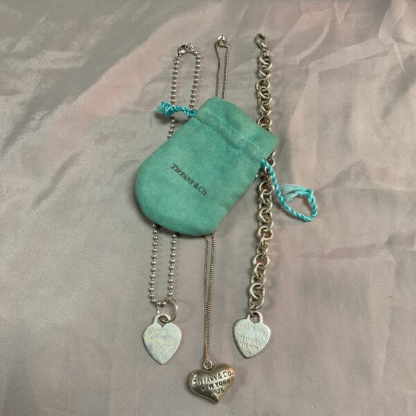 Silver Tiffany style necklace set with heart pendants.
