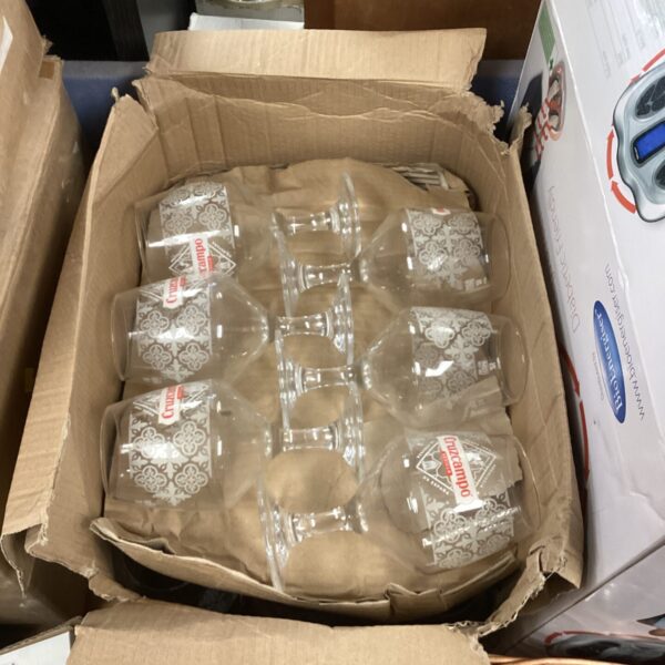 Box of eighteen new Cruzcampo beer glasses, unopened.