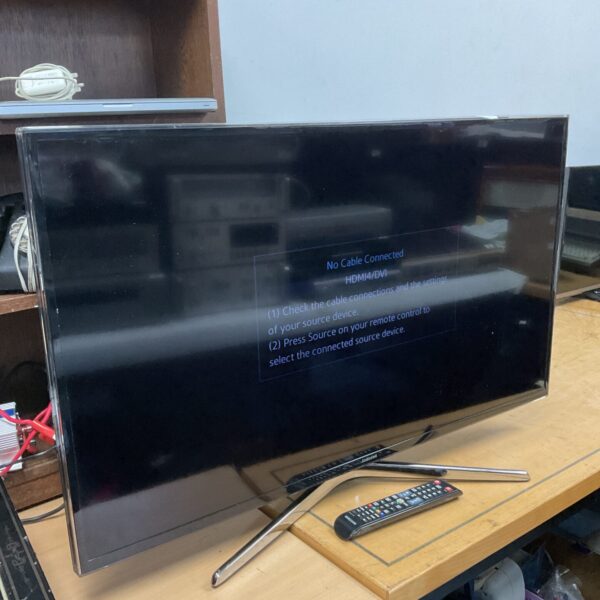Samsung 40 inch 4K smart TV in a home setting.