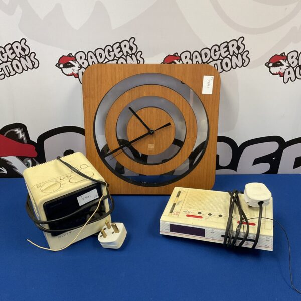 Retro Umbra alarm clock with wooden case and white dial.